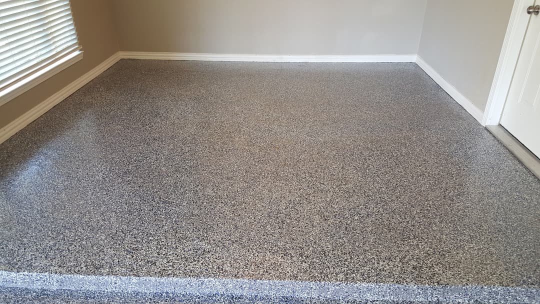 Clean, polished speckled concrete floor showcasing modern interior design elements.