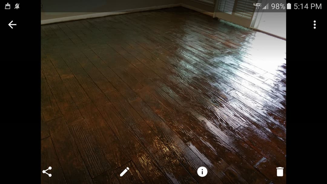 Glossy wooden floor showcasing rich texture and shine in a well-lit indoor space.