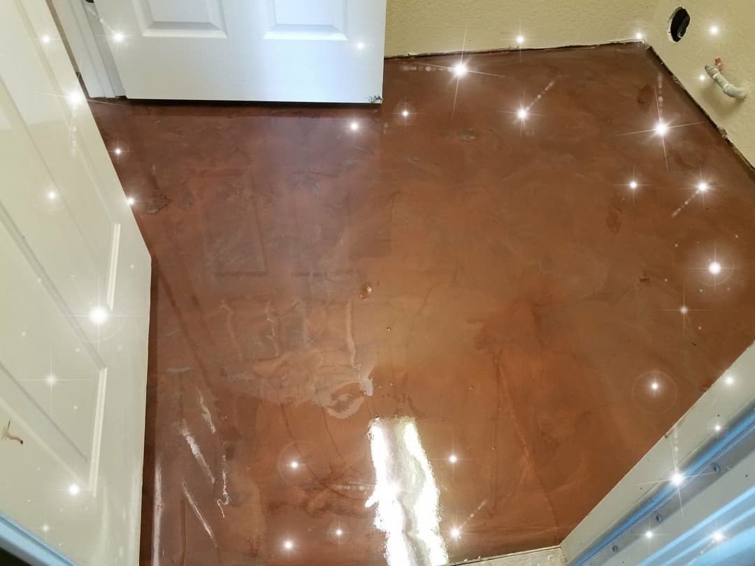 Shiny, newly finished concrete floor in a modern room with sparkling effects.